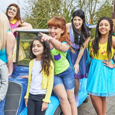 Kids Looking With Friends On Car