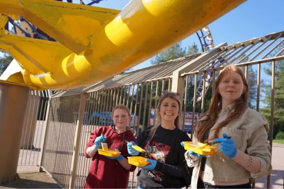 A group of women holding yellow food trays

AI-generated content may be incorrect.
