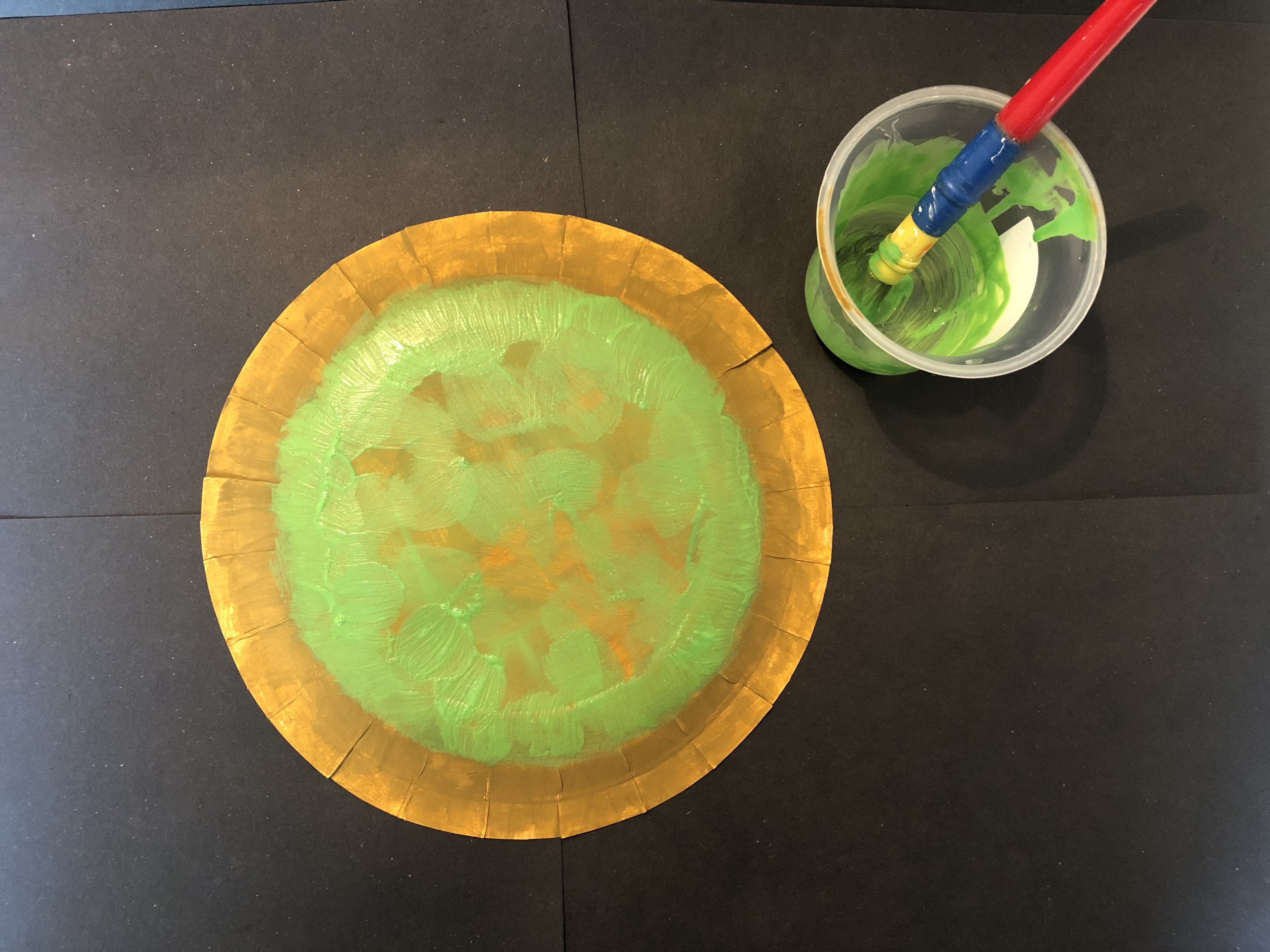 Create a Turtle Step 2: Lightly paint green paint over the top of the brown paint and let dry.