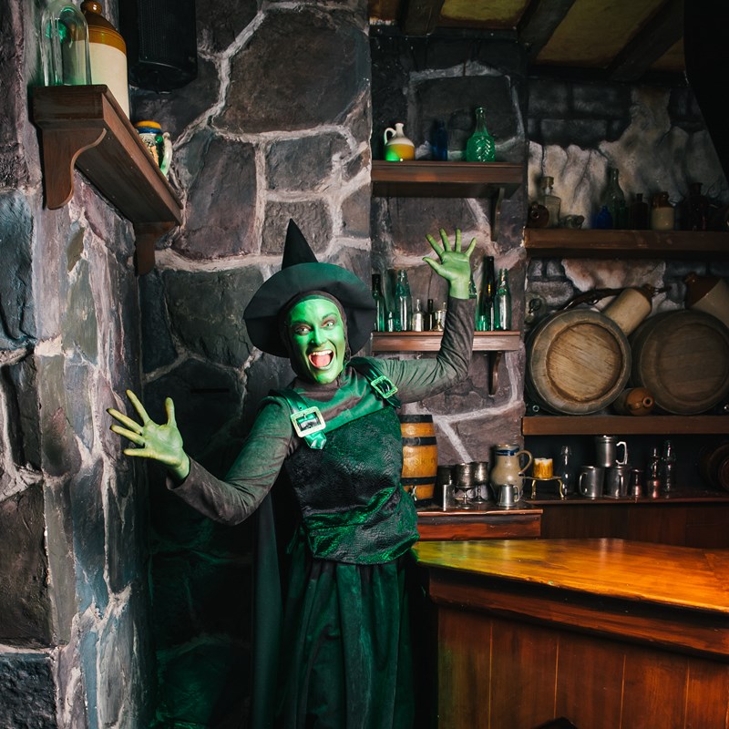 Witch in Poison Apple Pub during Halloween at Shrek's Adventure! London