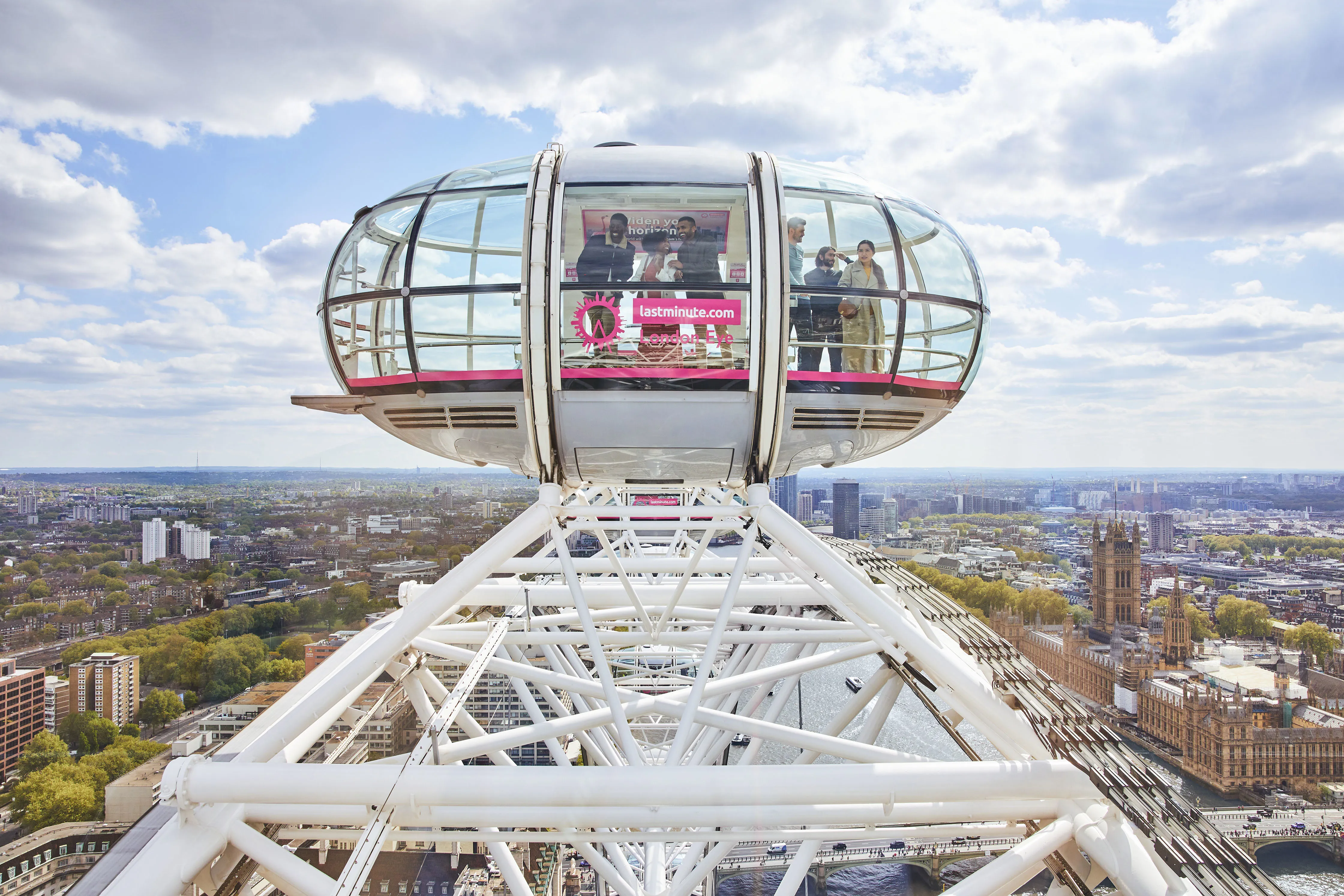 Families looking out on the London skyline from a pod on The London Eye