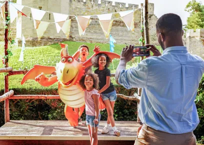 A person taking a picture of a group of children

AI-generated content may be incorrect.