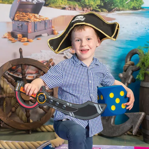 A child wearing a pirate hat and holding a toy sword

AI-generated content may be incorrect.