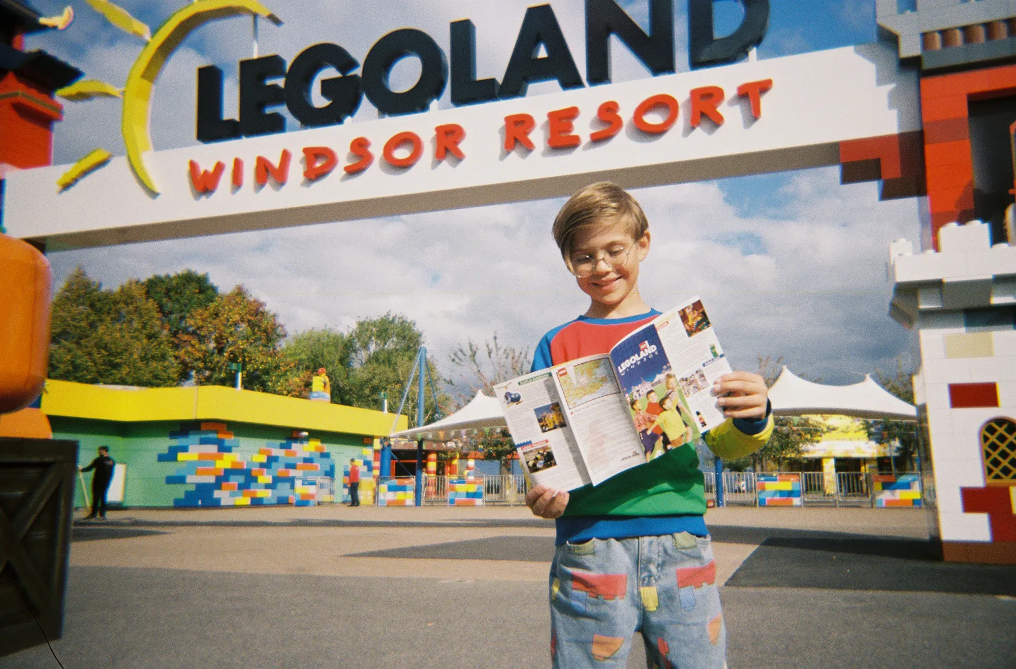 Boy Reading 1996 Legoland Map At Legoland Windsor Entrance