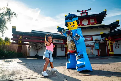 A child standing next to a person in a lego garment

AI-generated content may be incorrect.